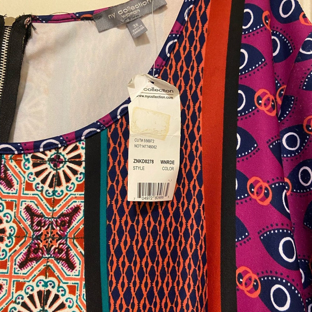 Multi colored printed dress, short sleeve mid length and easy to wear.